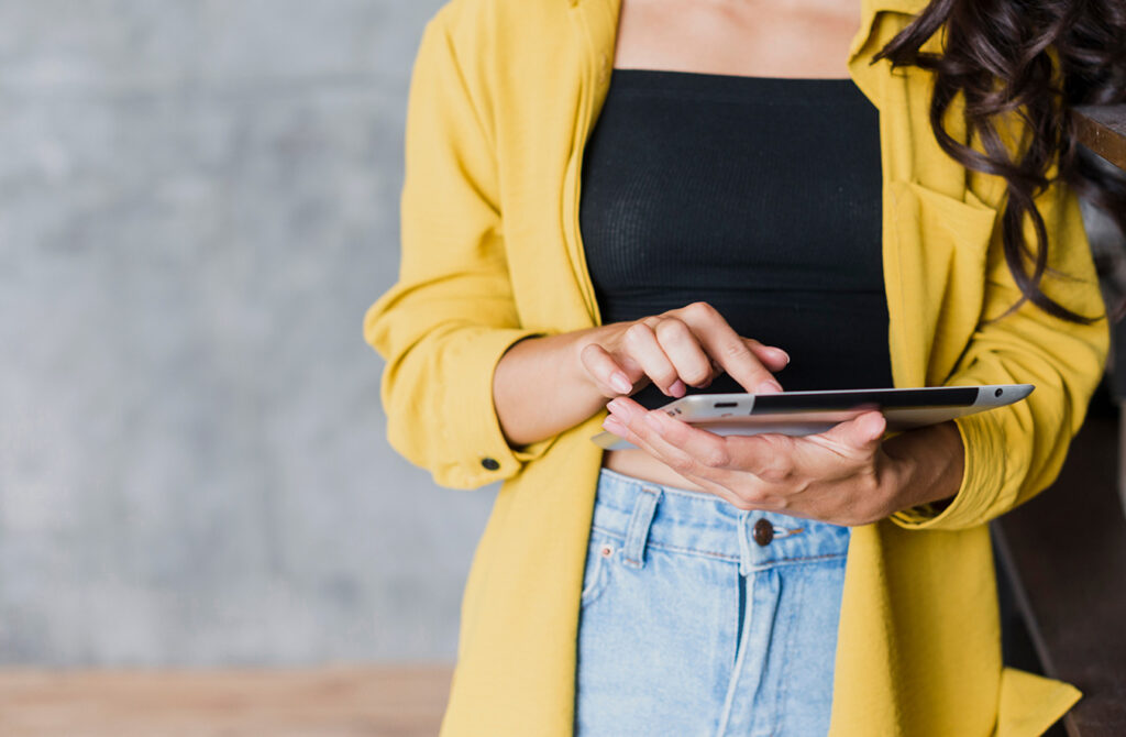 Girl Holding a Tablet Banner Image