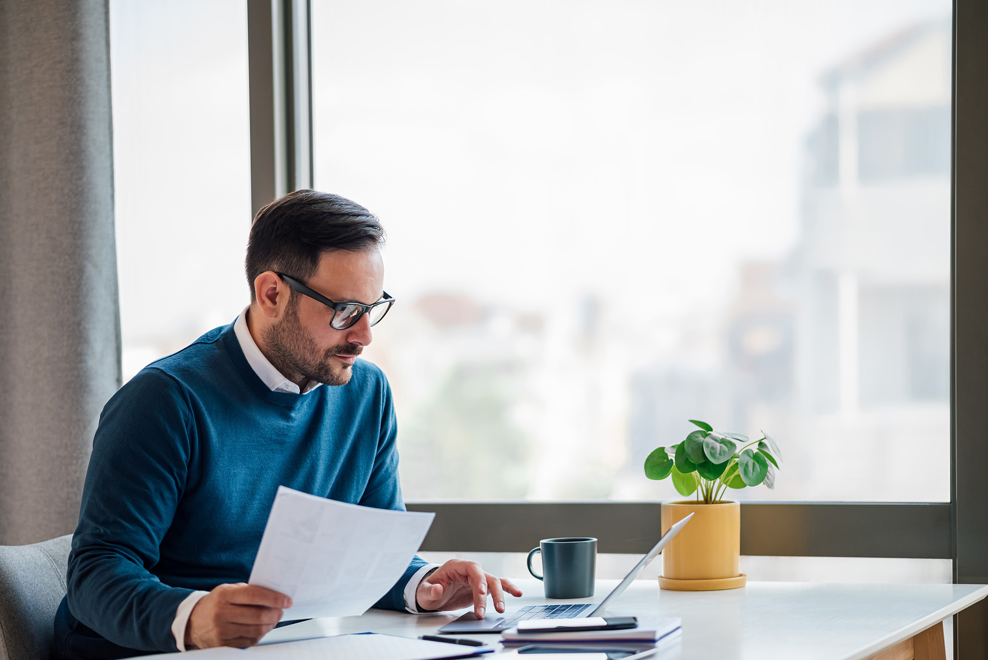 Man Working on a Laptop Banner Image