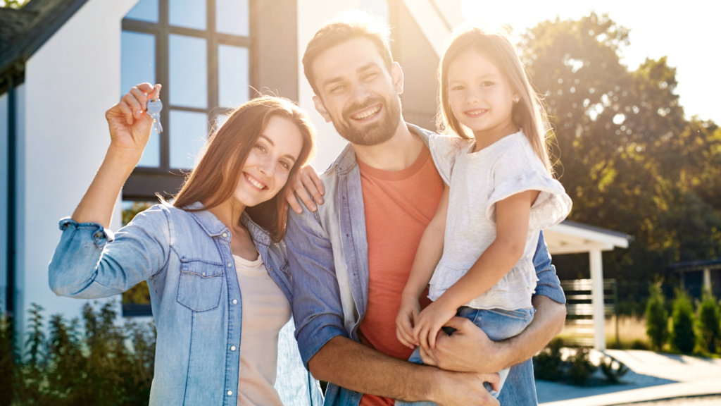 Couple Flaunting the Key to Their New Home Built by a Home Builder Banner Image