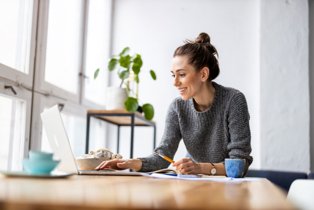Woman Customising Her Home Design on a Laptop in Australia